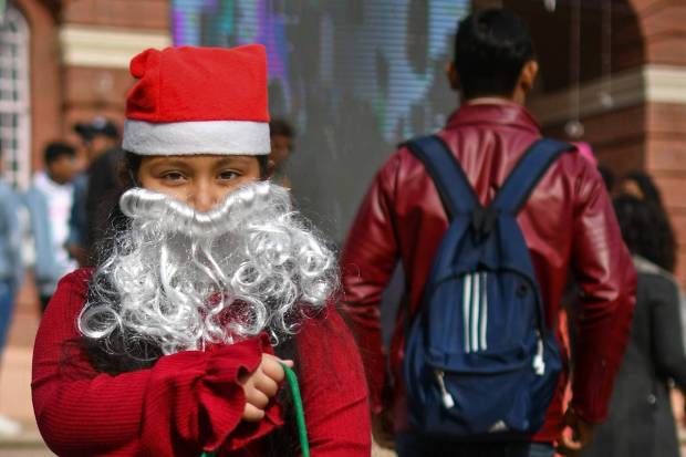 New Delhi: A child dressed as Santa at Sacred Heart Cathedral Catholic Church on Christmas, in New Delhi. (PTI Photo)
