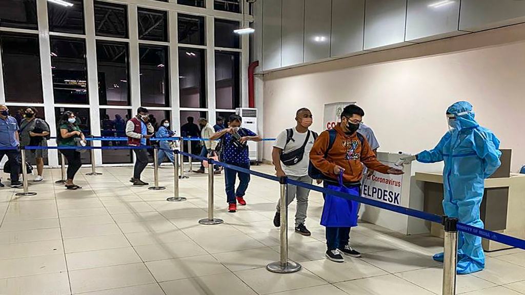 Passengers undergo thermal screening as random COVID-19 testing starts at various airports across the country in the wake of rising cases of Coronavirus globally. (PTI Photo)
 Passengers undergo thermal screening as random COVID-19 testing starts at various airports across the country in the wake of rising cases of Coronavirus globally. (PTI Photo)