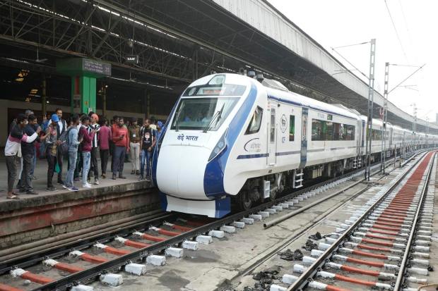 A security personnel checks doors of the pilot's cabin in Vande Bharat Express train upon its arrival at Howrah railway station in Kolkata.