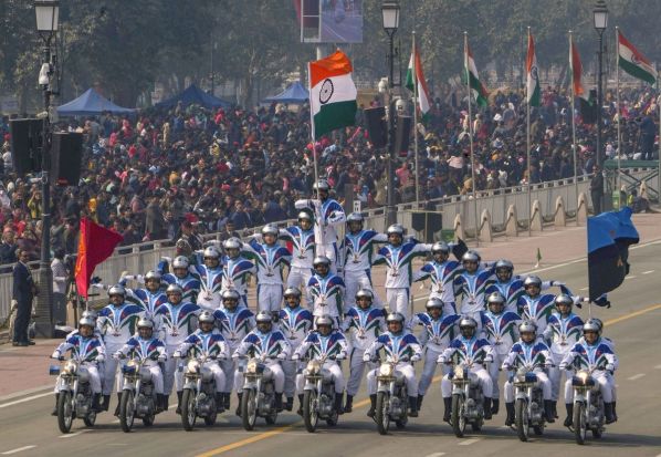 An Indian army daredevil team displays their skill on motorcycles as they drive through the ceremonial Kartavya Path during the 74th Republic Day celebrations. (Image: PTI)