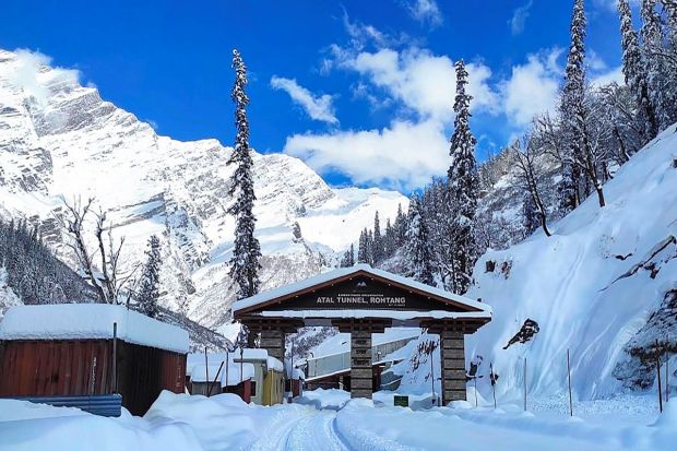 Snow covered the National Highway following heavy snowfall at the south portal of the Atal Tunnel in Rohtang on Jan 14, 2023. (Image: PTI)