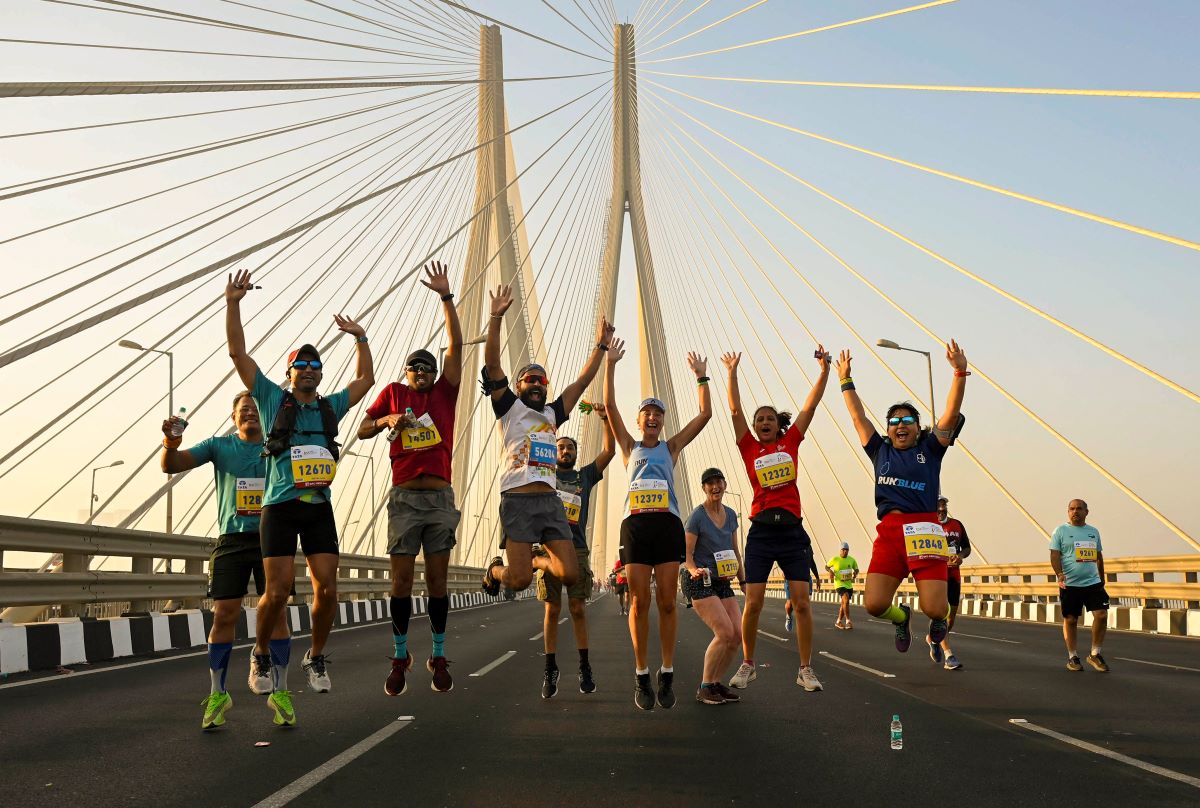 People participate in the Mumbai Marathon 2023 in Mumbai on Sunday. (Image: PTI)