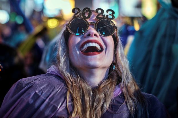 A reveller laughs as she waits for the countdown during the New Year's Eve celebrations in Times Square in New York. (Image/AP)