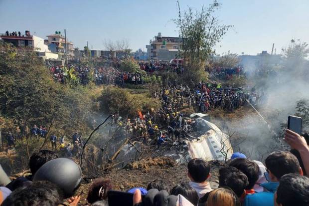 A general view of people gathered after the plane crash in Pokhara, Nepal. Picture obtained from social media. Naresh Giri/via REUTERS