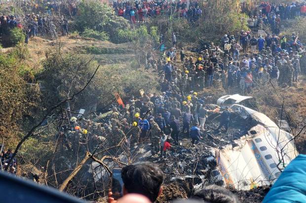 A general view of people gathered after the plane crash in Pokhara, Nepal. Picture obtained from social media. Naresh Giri/via REUTERS
