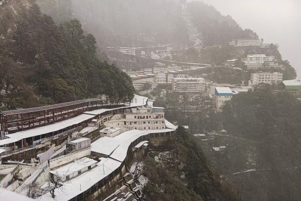 Mata Vaishno Devi shrine and surrounding areas covered with snow after fresh snowfall in Katra. (Image: PTI)