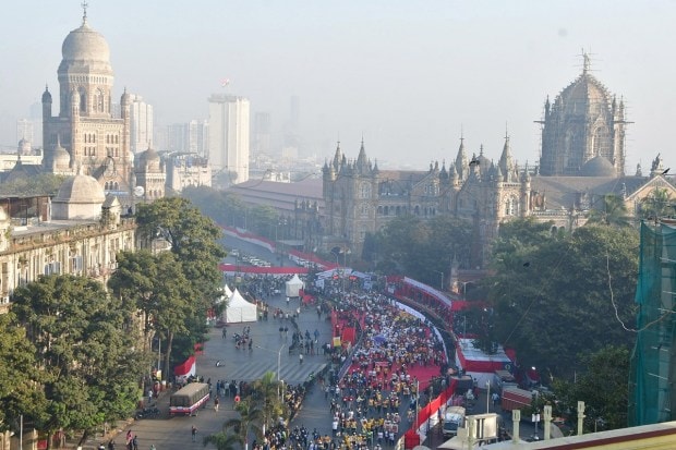 People run during the Mumbai Marathon 2023 in Mumbai on Sunday. (Image: PTI)