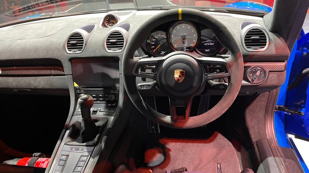 The interior of this sports car features a touchscreen infotainment system, a timepiece between the front AC vents, steering wheel with paddle shifters and a host of control buttons on the centre console. Additionally the dashboard is finished in grey coloured soft touch material. 
