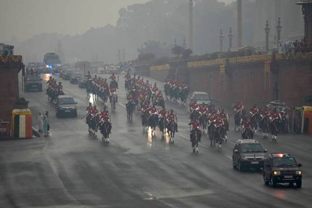 Indian president motorcade arrives for the Beating Retreat ceremony amidst rain at Raisina hills, the government seat of power, in New Delhi, India. The ceremony performed every year on the evening of January 29 by the bands of three wings of the Indian military marks the end of Republic Day festivities. (AP Photo)
