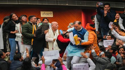 AAP and BJP councilors clash during the election of Mayor and Dy Mayor at the Civic Centre, in New Delhi, Friday, Jan. 6, 2023. (PTI Photo/Ravi Chaudhary)
