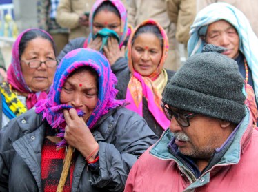 Hotel Malari Inn owner Thakur Singh Rana and his family members react ahead of its demolition, in Joshimath, Thursday, Jan. 12, 2023. (PTI Photo)