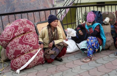 People shift with their belonging from an unsafe building in Joshimath, Thursday, Jan. 12, 2023. (PTI Photo)
