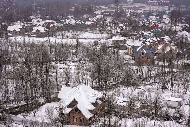 Srinagar: An area is covered with snow during light snowfall on the outskirts of Srinagar. (PTI Photo)