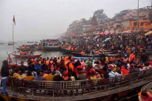 Many people from different parts of India and local residents visited Varanasi to watch the sunrise of 2023. Tourists take a boat ride during New Year celebrations. 