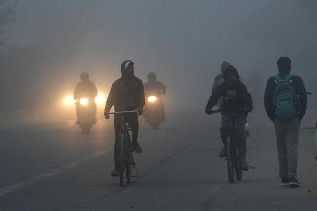 People commute during a cold and foggy morning in New Delhi (PTI Photo)