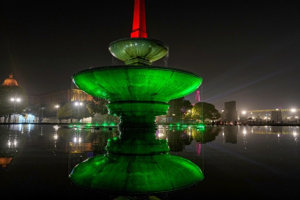 A fountain near Vijay Chowk is illuminated in the colours of Tiranga. (PTI photo)