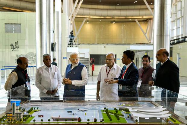 **EDS: IMAGE VIA PIB** Shivamogga: Prime Minister Narendra Modi with Union Minister Pralhad Joshi, Karnataka Chief Minister Basavaraj Bommai and former Karnataka chief minister B.S. Yediyurappa during the inauguration of the Shivamogga Airport, Monday, Feb. 27, 2023. (PTI Photo)(PTI02_27_2023_000110B)