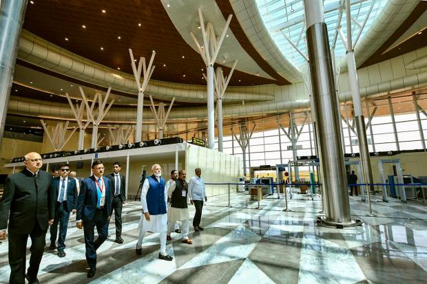 Shivamogga: Prime Minister Narendra Modi with Union Minister Pralhad Joshi and Karnataka Chief Minister Basavaraj Bommai during the inauguration of the Shivamogga Airport, Monday, Feb. 27, 2023. (PTI Photo)(PTI02_27_2023_000113A)