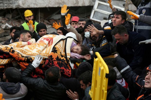Rescuers carry out a girl from a collapsed building following an earthquake in Diyarbakir, Turkey February 6, 2023. (Photo/Reuters)