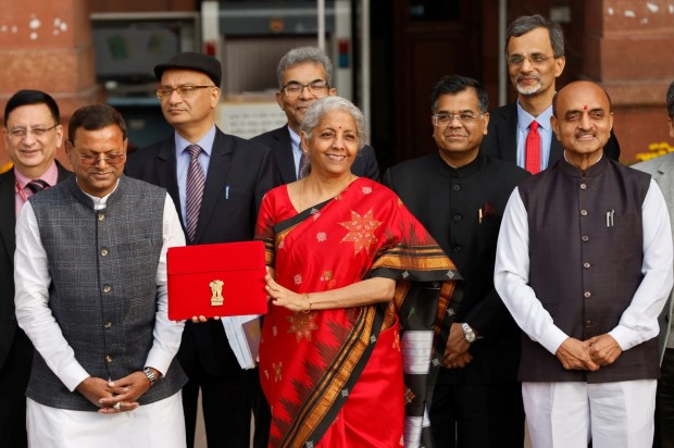 ndia's Finance Minister Nirmala Sitharaman holds up a folder with the Government of India's logo as she leaves her office to present the federal budget in the parliament, in New Delhi, India, February 1, 2023. REUTERS/Adnan Abidi