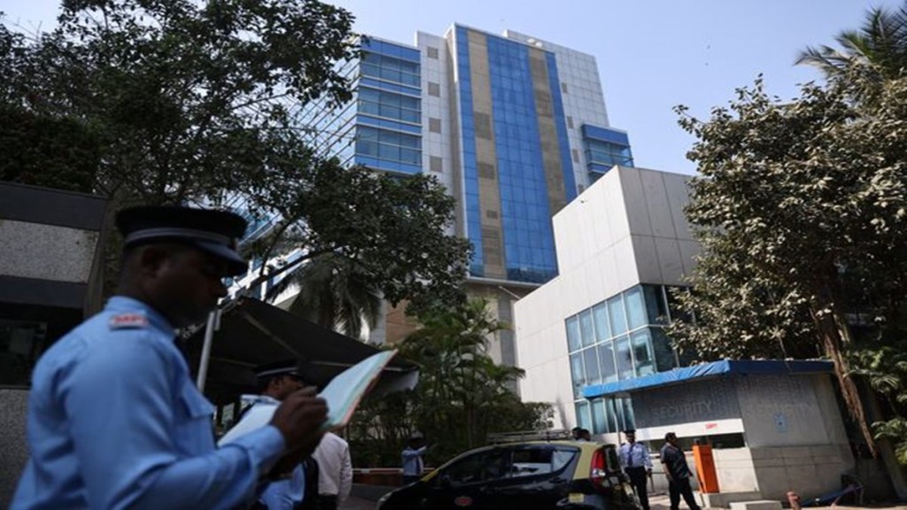 A private security guard stands outside a building with BBC offices, where income tax officials are conducting a search, in Mumbai, India, February 14, 2023. REUTERS/Francis Mascarenhas. A private security guard stands outside a building with BBC offices, where income tax officials are conducting a search, in Mumbai, India, February 14, 2023. REUTERS/Francis Mascarenhas.