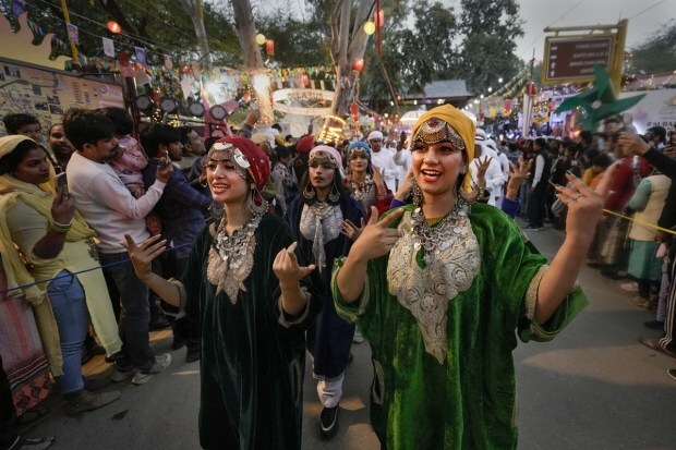 Kashmiri artists perform during a parade at the 36th Surajkund International Crafts Mela. (PTI photo)