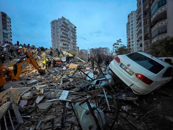Emergency teams search for people in a destroyed building in Adana, Turkey, Monday, Feb. 6, 2023. A powerful quake has knocked down multiple buildings in southeast Turkey and Syria and many casualties are feared. (Photo/AP)