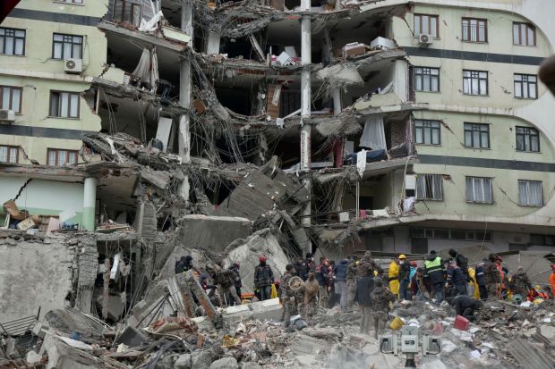 Emergency teams search for people in a destroyed building in Adana, Turkey, Monday, Feb. 6, 2023. A powerful quake has knocked down multiple buildings in southeast Turkey and Syria and many casualties are feared. (Photo/AP)