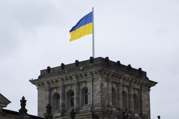 A Ukrainian national flag flies atop the Reichstag building, the seat of Germany's lower house of parliament Bundestag. (Reuters photo)