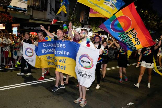 Supporters of Ukraine march in the 45th Anniversary Sydney Gay and Lesbian Mardi Gras Parade in Oxford Street, Sydney, Australia. (AP Photo)