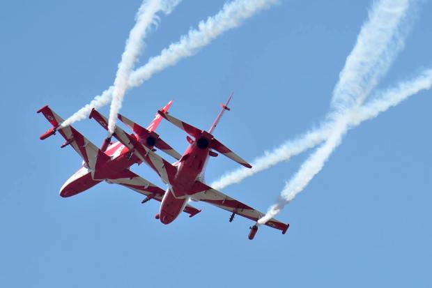 Indian Air Force's aerobatic team Suryakiran perform maneuvers on the second day of the Aero India 2023 at Yelahanka air base in Bengaluru, India, Tuesday, Feb. 14, 2023. Aero India is a biennial event with flying demonstrations by stunt teams and militaries and commercial pavilions where aviation companies display their products and technology. (AP Photo/Aijaz Rahi)