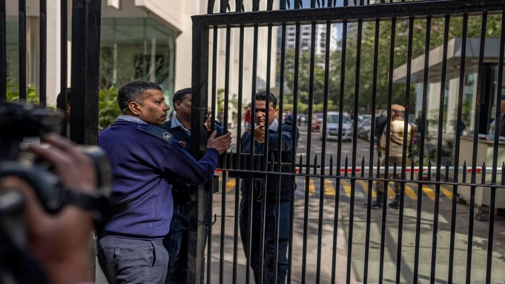 Private security guards close the gate of a building housing BBC office in New Delhi, India, Tuesday, Feb. 14, 2023. (AP Photo/Altaf Qadri)
