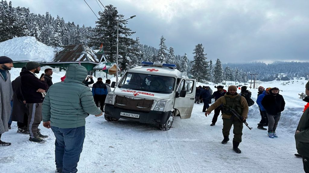 An ambulance leaves carrying the bodies of two foreigners who were killed in an avalanche in Gulmarg, 55 kilometers (34 miles) from Srinagar, in Indian controlled Kashmir, Wednesday, Feb 1, 2023. (AP Photo/Umar Mehraj)