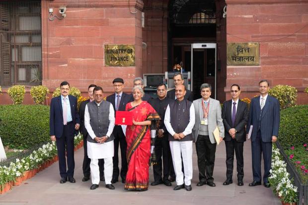 New Delhi: Union Finance Minister Nirmala Sitharaman with Ministers of State Bhagwat Kishanrao Karad and Pankaj Chaudhary and officials poses for photographs outside the Finance Ministry at North Block, in New Delhi, Wednesday, Feb. 1, 2023, ahead of the presentation of the Union Budget 2023-24. Sitharaman will be presenting her fifth Union Budget in Parliament. (PTI Photo/Manvender Vashist Lav) (PTI02_01_2023_000008B)