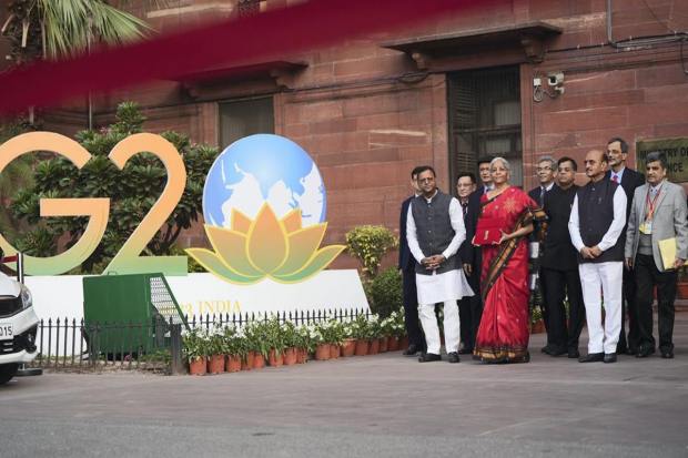 New Delhi: Union Finance Minister Nirmala Sitharaman with Ministers of State Bhagwat Kishanrao Karad and Pankaj Chaudhary and officials poses for photographs outside the Finance Ministry at North Block, in New Delhi, Wednesday, Feb. 1, 2023, ahead of the presentation of the Union Budget 2023-24. Sitharaman will be presenting her fifth Union Budget in Parliament. (PTI Photo/Subhav Shukla) (PTI02_01_2023_000010B)