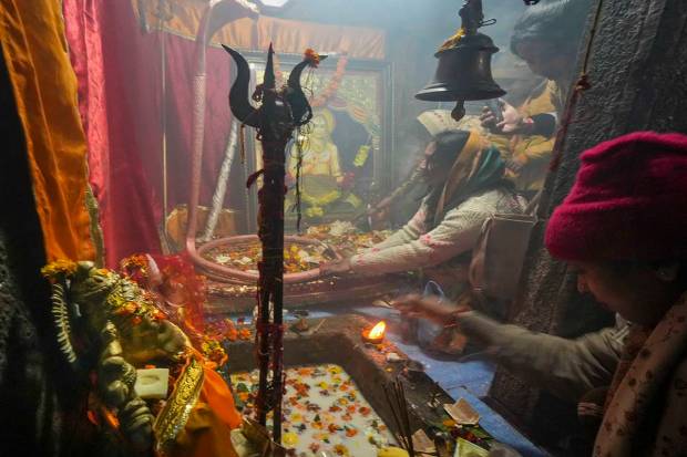 Srinagar: Devotees perform puja at Shankaracharya temple on the occasion of 'Maha Shivratri', in Srinagar. (PTI)