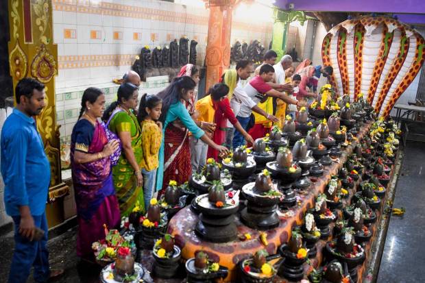 Bengaluru: Devotees offer prayers at a Lord Shiva temple on the occasion of 'Maha Shivratri', in Bengaluru. (PTI Photo)