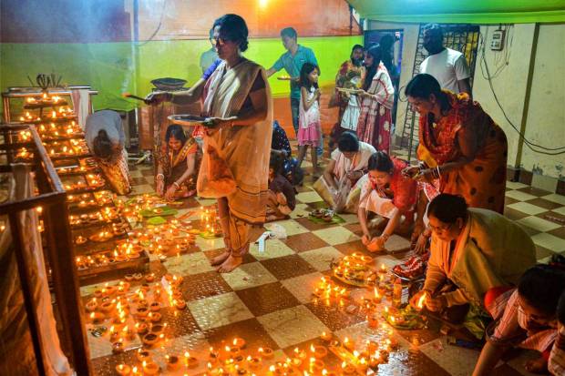 Dibrugarh: Devotees light lamps at a Lord Shiva temple on the occasion of 'Maha Shivratri', in Dibrugarh. (PTI Photo)