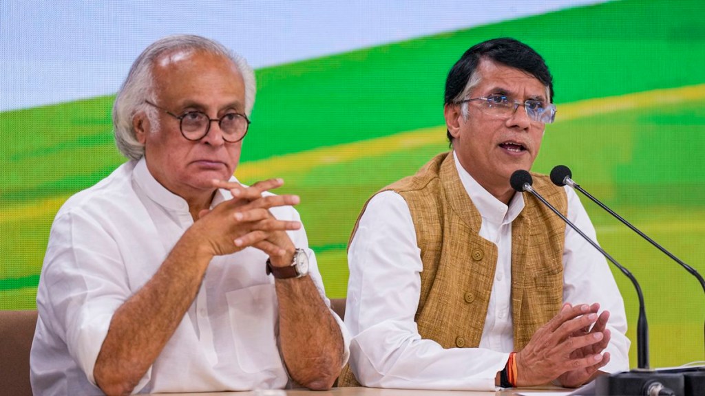 Congress leader Pawan Khera with party leader Jairam Ramesh addresses a press conference at AICC headquarters, in New Delhi, Monday, Feb. 20, 2023. (PTI Photo)
