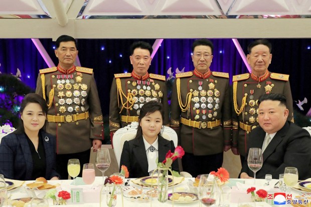 North Korean leader Kim Jong Un, his wife Ri Sol Ju and their daughter Kim Ju Ae attend a banquet to celebrate the 75th anniversary of the Korean People's Army at Pyongyang, North Korea. (Reuters photo)