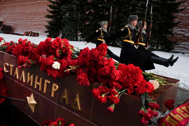 Members of honor guards march at the Tomb Stalingrad during a wreath-laying ceremony at the Tomb of the Unknown Soldier near the Kremlin Wall. (AP photo)