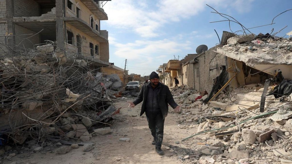 A man walks past collapsed buildings following a devastating earthquake in the town of Jinderis, Aleppo province, Syria, Tuesday, Feb. 14, 2023. The death toll from the earthquakes of Feb. 6, that struck Turkey and northern Syria is still climbing. (AP Photo/Ghaith Alsayed) A man walks past collapsed buildings following a devastating earthquake in the town of Jinderis, Aleppo province, Syria, Tuesday, Feb. 14, 2023. The death toll from the earthquakes of Feb. 6, that struck Turkey and northern Syria is still climbing. (AP Photo/Ghaith Alsayed)