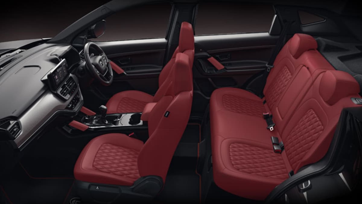 The Red Dark edition of these Tata SUVs flaunt the Oberon Black shade which is accentuated with an exquisite Carnelian Red interior theme.