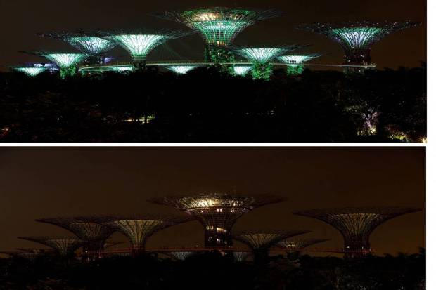 A combination picture shows a view of the Supertree Grove structures at Gardens by the Bay before and after lights are switched off to mark Earth Hour, in Singapore. REUTERS