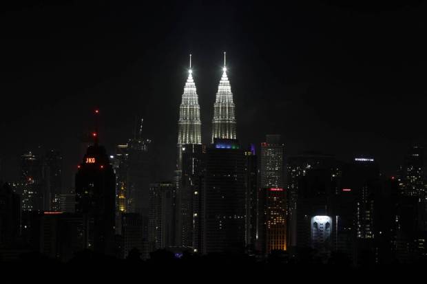 A view of Kuala Lumpur's skyline with Petronas Twin Tower at the centre as the lights switched on after Earth Hour in Kuala Lumpur, Malaysia. REUTERS