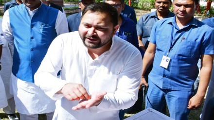 Bihar Deputy Chief Minister Tejashwi Yadav speaks to the media regarding the CBI raid in Rashtriya Janata Dal (RJD) chief Lalu Prasad Yadav and party MLA Rabri Devi's residence in connection with the land for jobs scam case, in Patna on Monday. (ANI Photo)