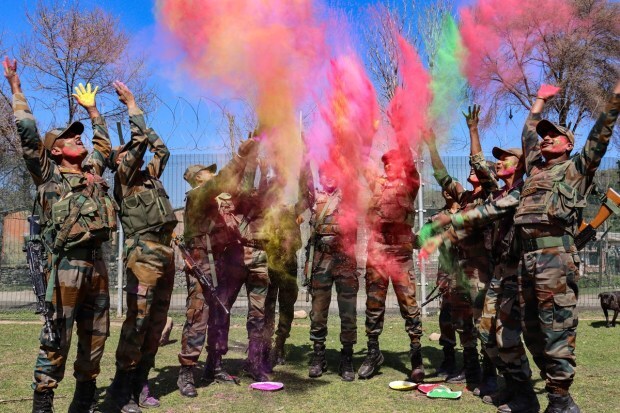 Army personnel celebrate the festival of Holi, near Line of Control (LoC) in Poonch district of Jammu and Kashmir. (PTI photo)