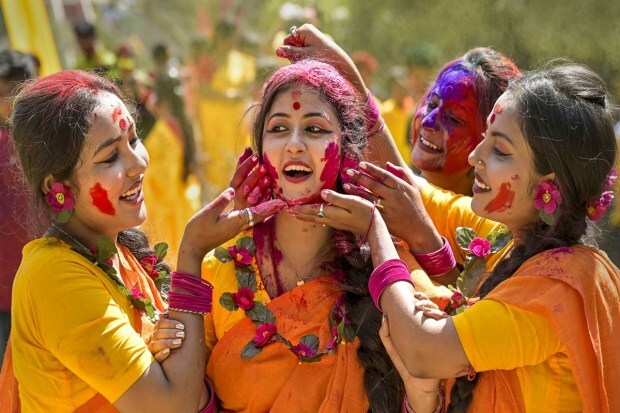 Women celebrate 'Dol Utsav', in West Bengal's Nadia. (PTI photo)