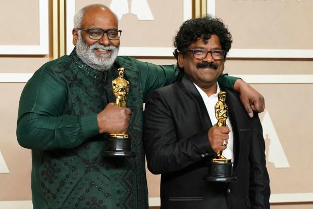 M.M. Keeravaani, left, and Chandrabose, winners of the award for best original song for "Naatu Naatu" from "RRR", pose in the press room at the Oscars on Sunday, March 12, 2023, at the Dolby Theatre in Los Angeles. AP/PTI(AP03_13_2023_000016A)