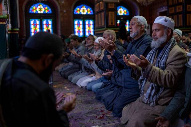 Kashmiri Muslims pray inside the shrine of Sufi saint Shiekh Abdul Qadir Jeelani in Srinagar, Kashmir. (AP Photo)
